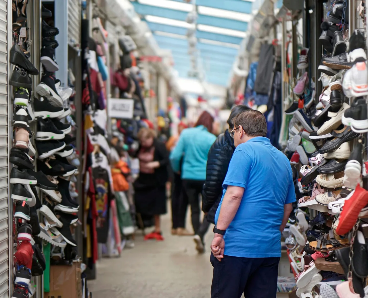 people, man, visiting, bazaar, goods, shoes, merchandise, for sale, commercial. What to expect from businesses for sale listings, and when to stop reading one