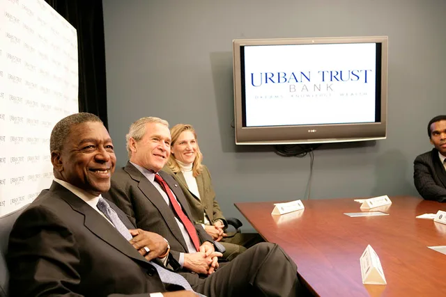 President George W. Bush sits with Bob Johnson, founder and chairman of the RLJ Companies, and Kathy Boden, right, president and CEO of Blue House Water Solutions , during a meeting to discuss the economy with small business owners and community bankers, Monday, Oct. 23, 2006 at the Urban Trust Bank. Seller preparation mistakes often look like sound decisions at the time
